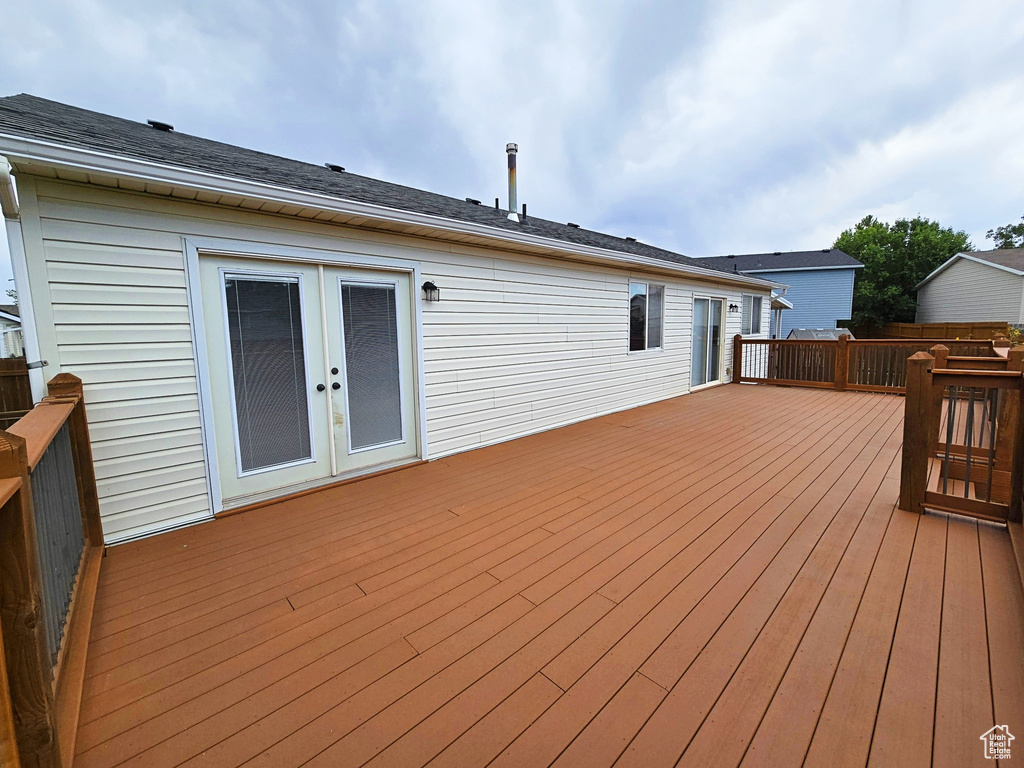 Wooden terrace featuring french doors
