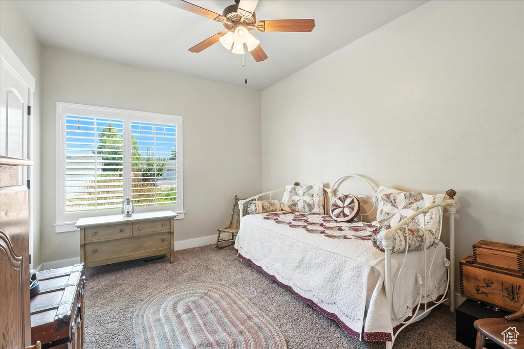 Bedroom featuring carpet and ceiling fan