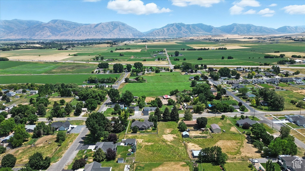 Overview of rural landscape featuring a mountainous background