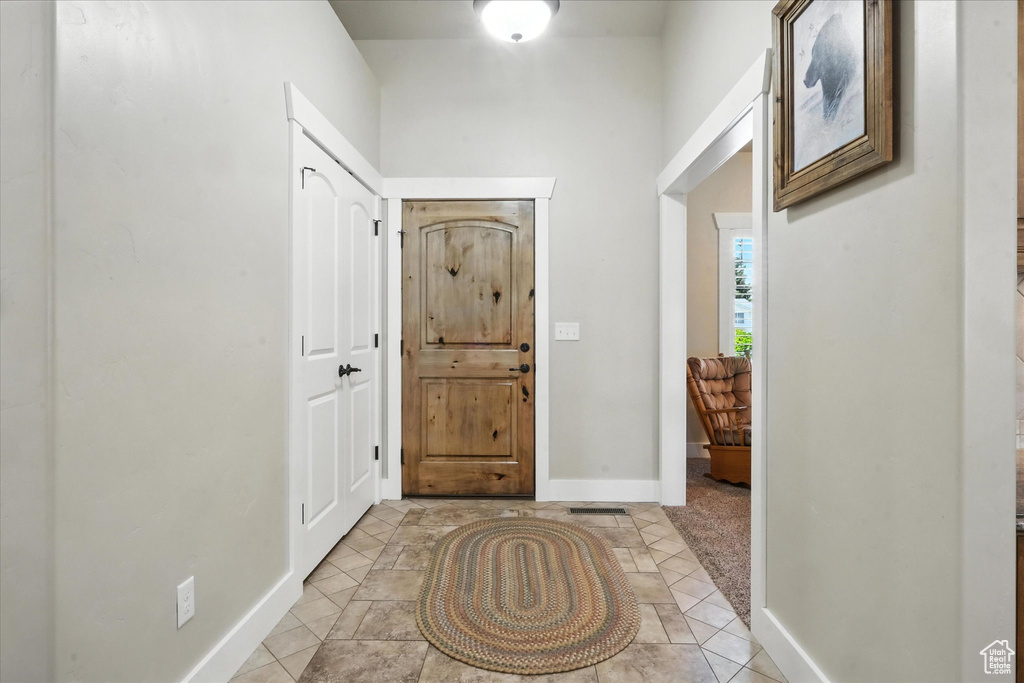 Entrance foyer featuring baseboards