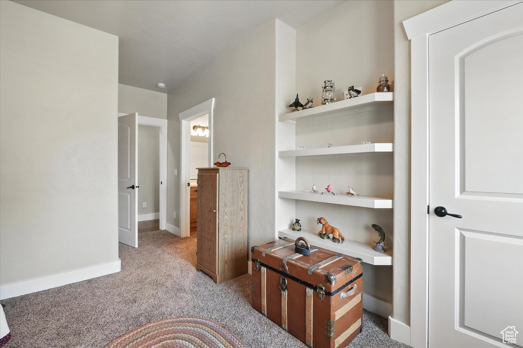 Hall with light colored carpet