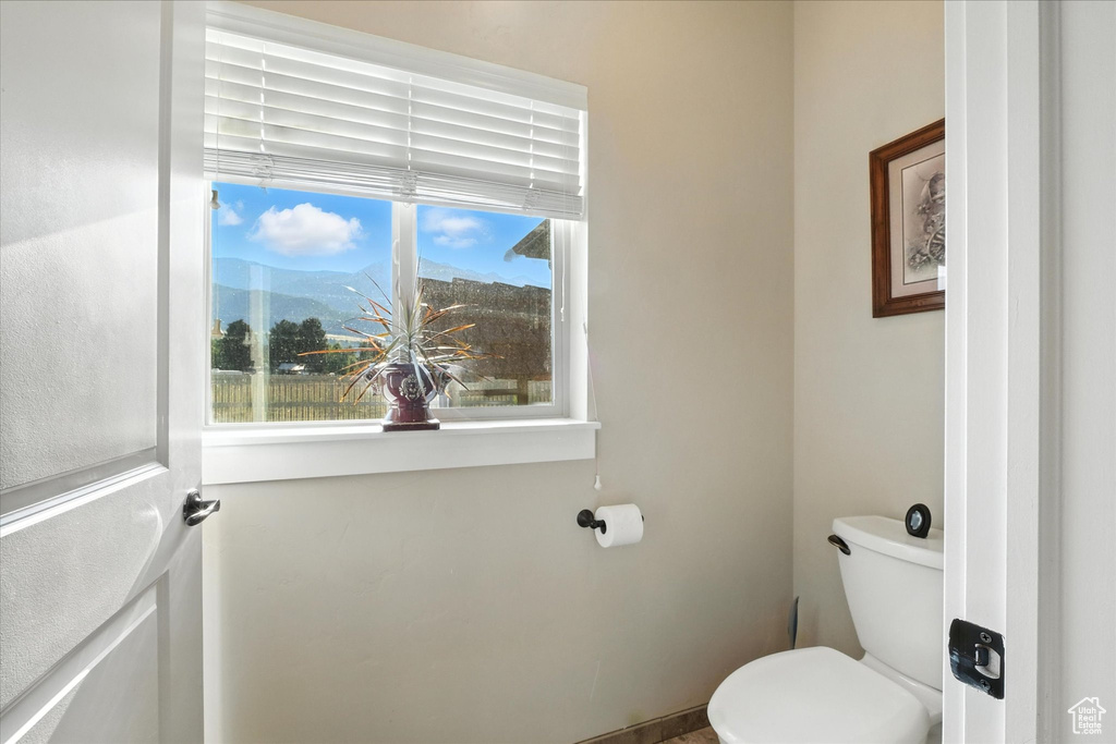 Bathroom with toilet and a mountain view