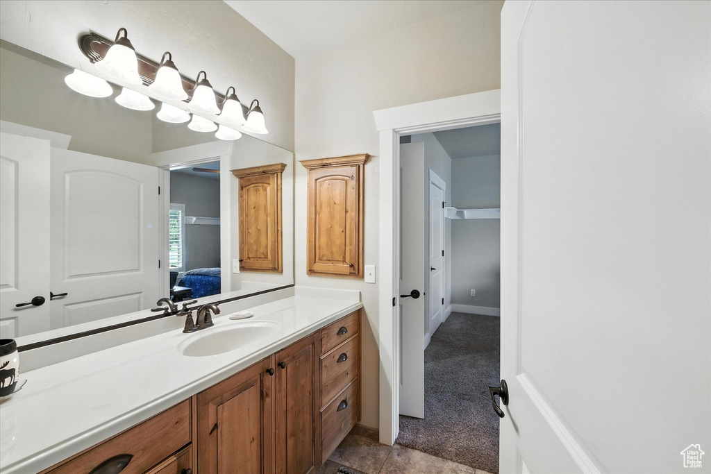 Bathroom featuring vanity and ensuite bath