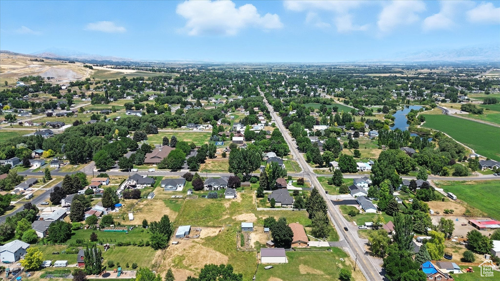 Aerial overview of property's location featuring a large body of water and nearby suburban area