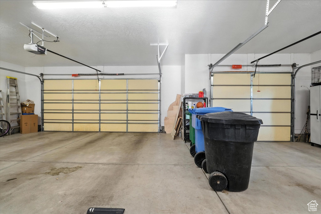 Garage featuring a garage door opener