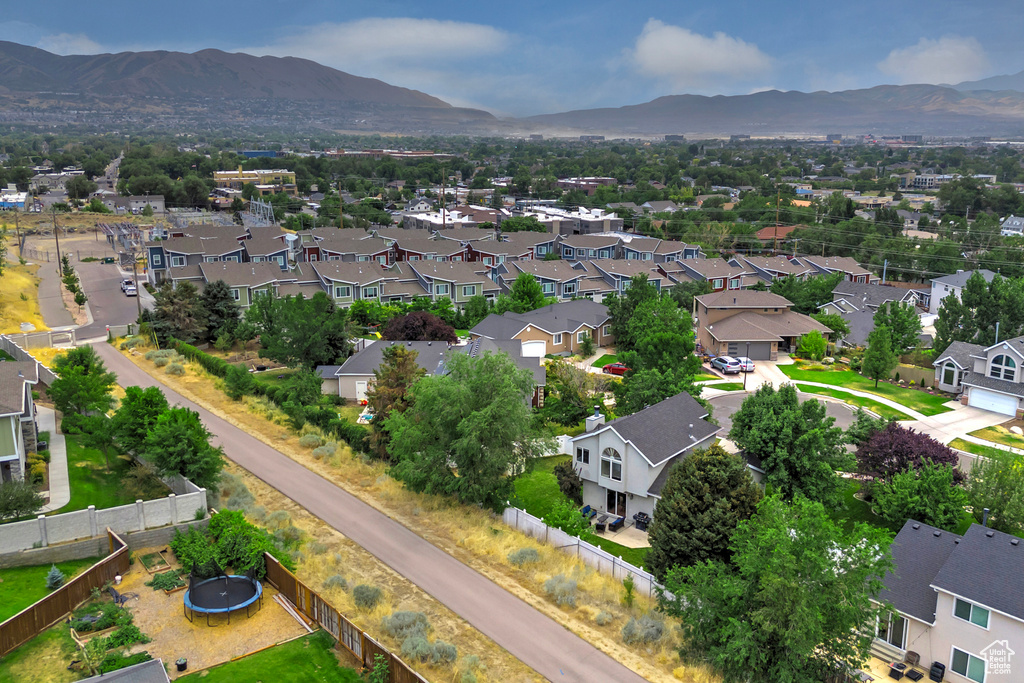 Aerial perspective of suburban area featuring a mountain backdrop