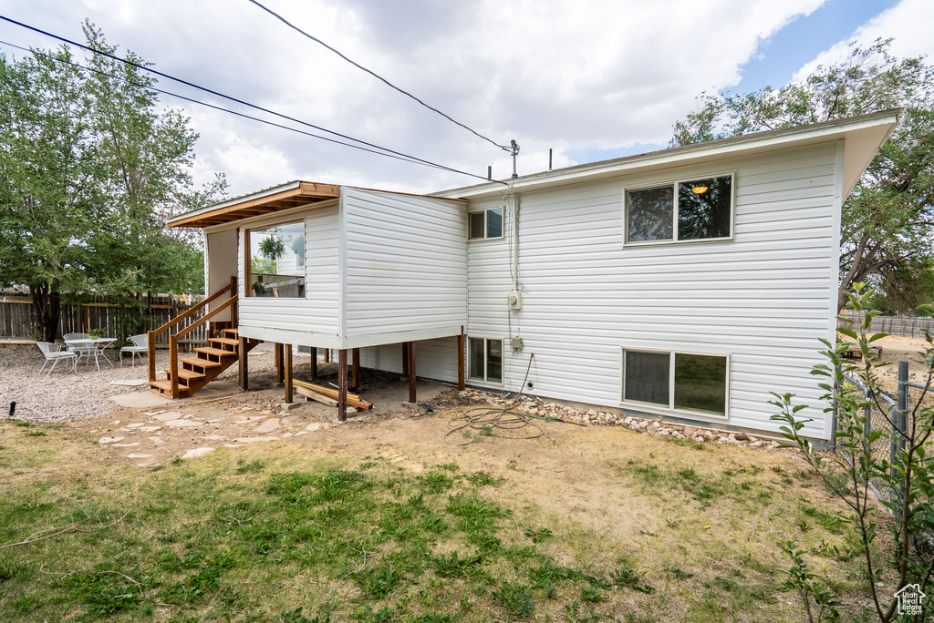 Rear view of property with stairs