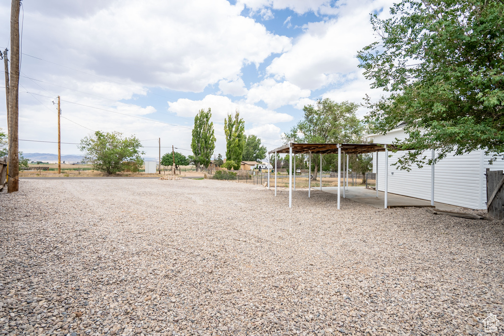 View of yard with a carport