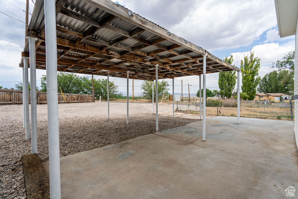 View of patio / terrace with a carport