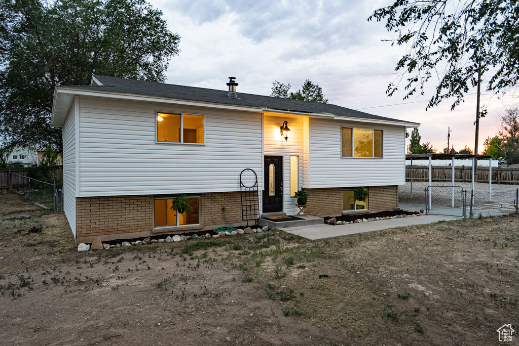 Raised ranch with brick siding