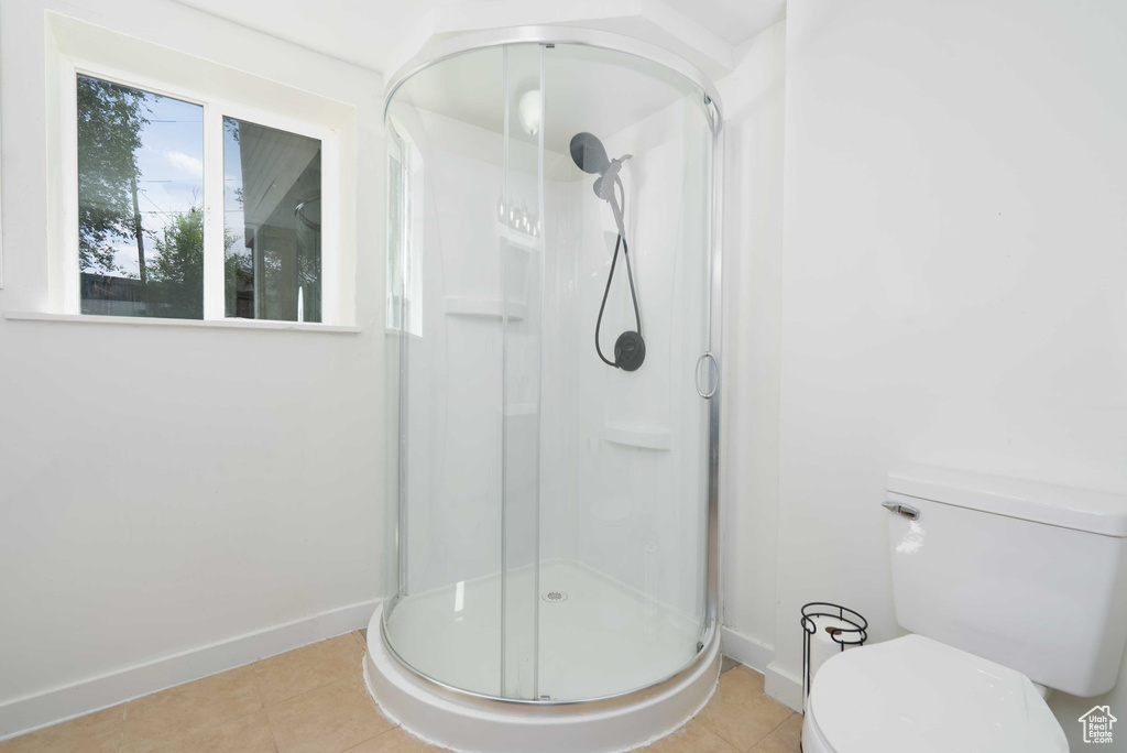 Bathroom featuring a stall shower and tile patterned floors