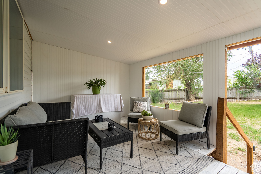 Sunroom featuring outdoor lounge area