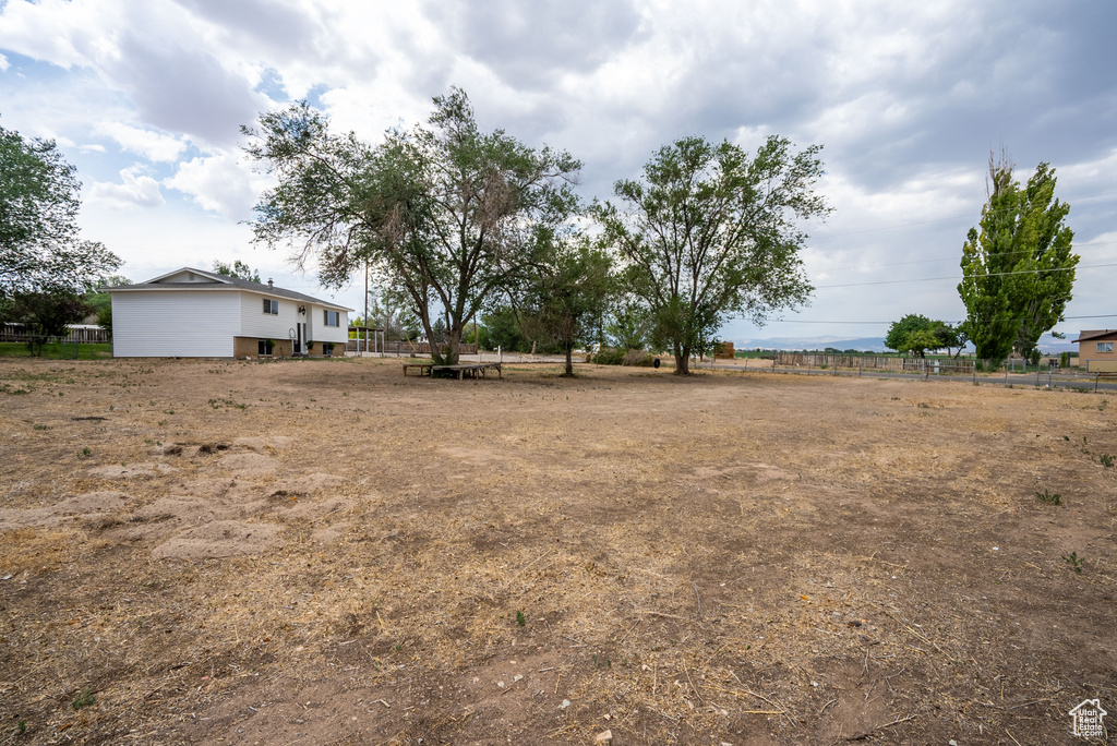 View of yard with a rural view