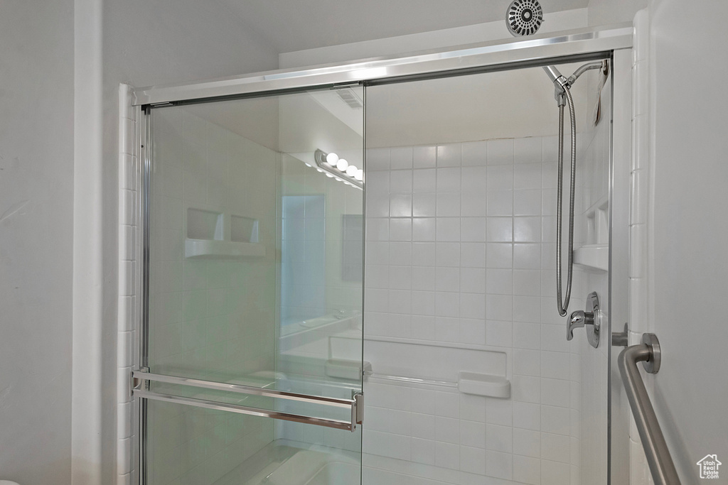 Full bath with a shower stall