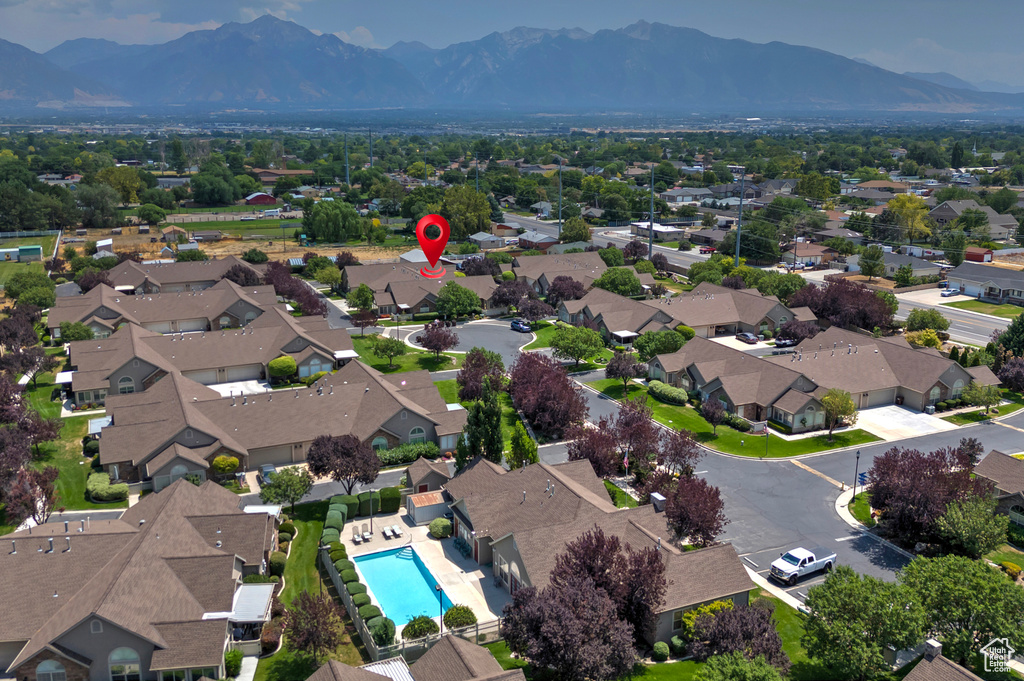 Aerial view of residential area with mountains and a pool area