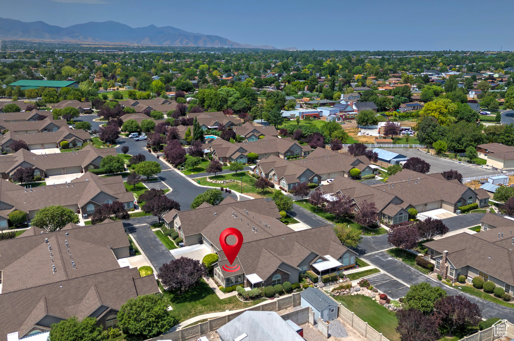 Aerial perspective of suburban area with a mountain backdrop