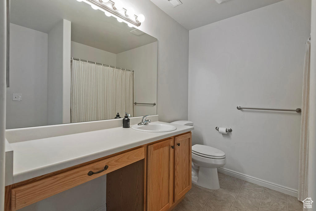 Bathroom featuring vanity and tile patterned flooring