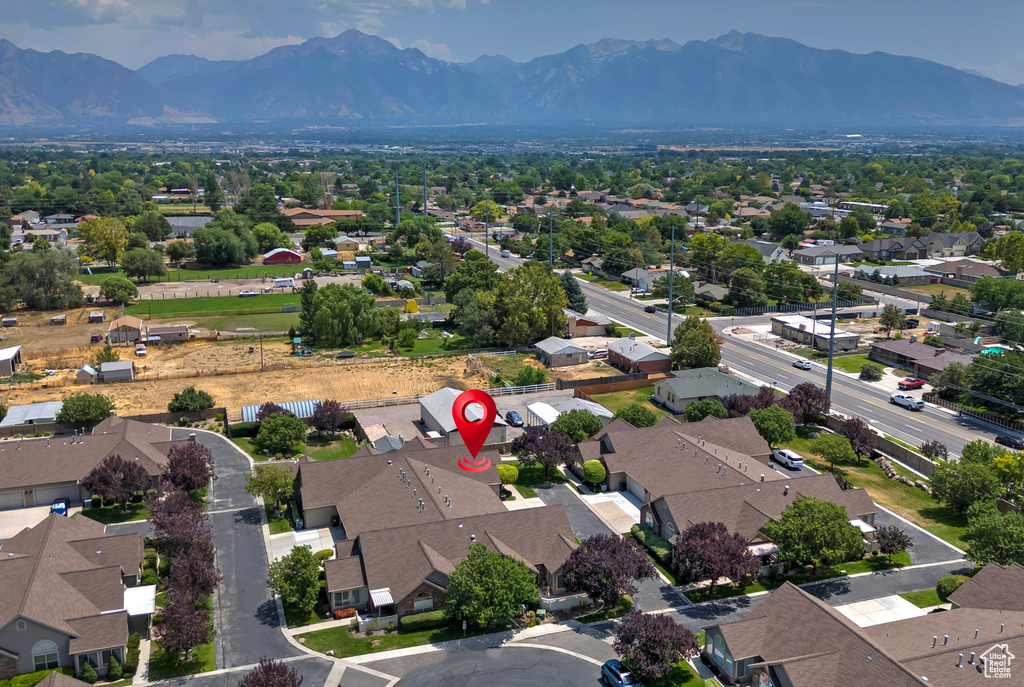 Aerial perspective of suburban area with a mountain backdrop