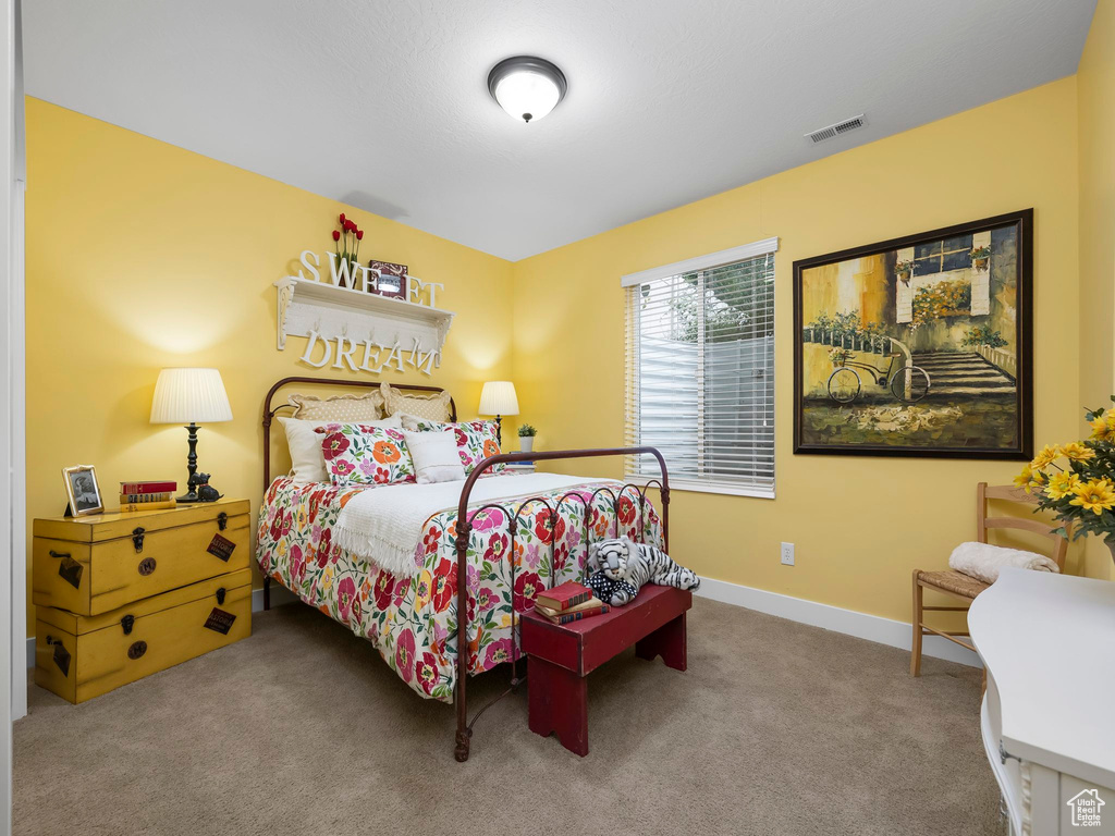 Bedroom with carpet and baseboards