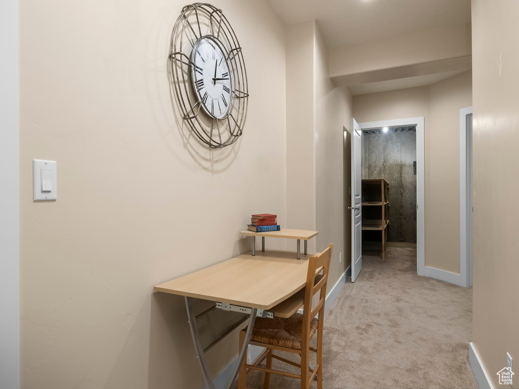 Hall featuring carpet floors and baseboards