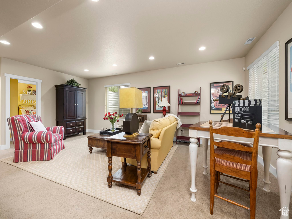 Living room featuring light carpet and recessed lighting