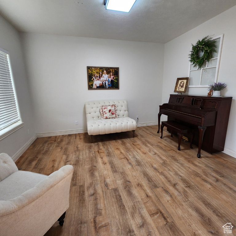 Sitting room featuring wood finished floors and baseboards