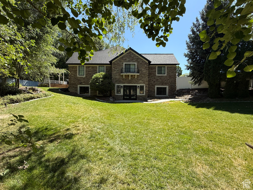 Rear view of house with french doors and brick siding