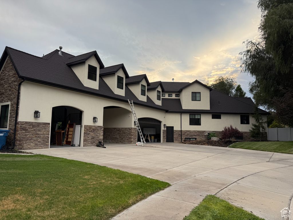 View of front of home with stucco siding and stone siding