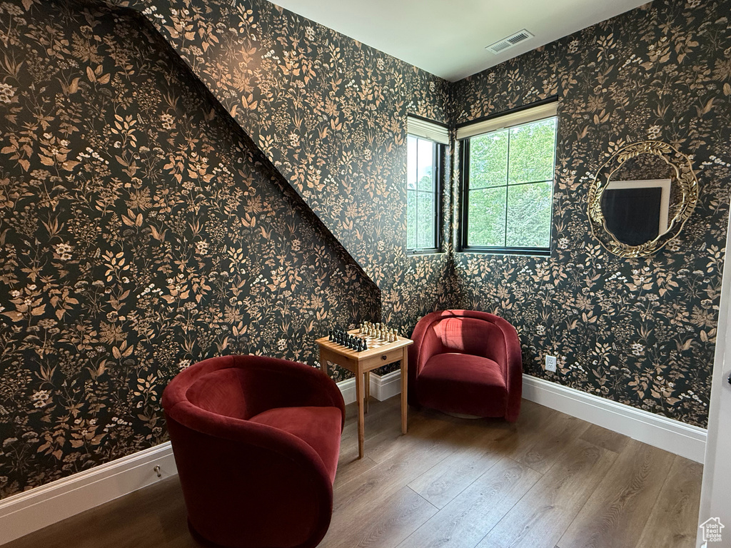 Sitting room featuring wood finished floors and baseboards