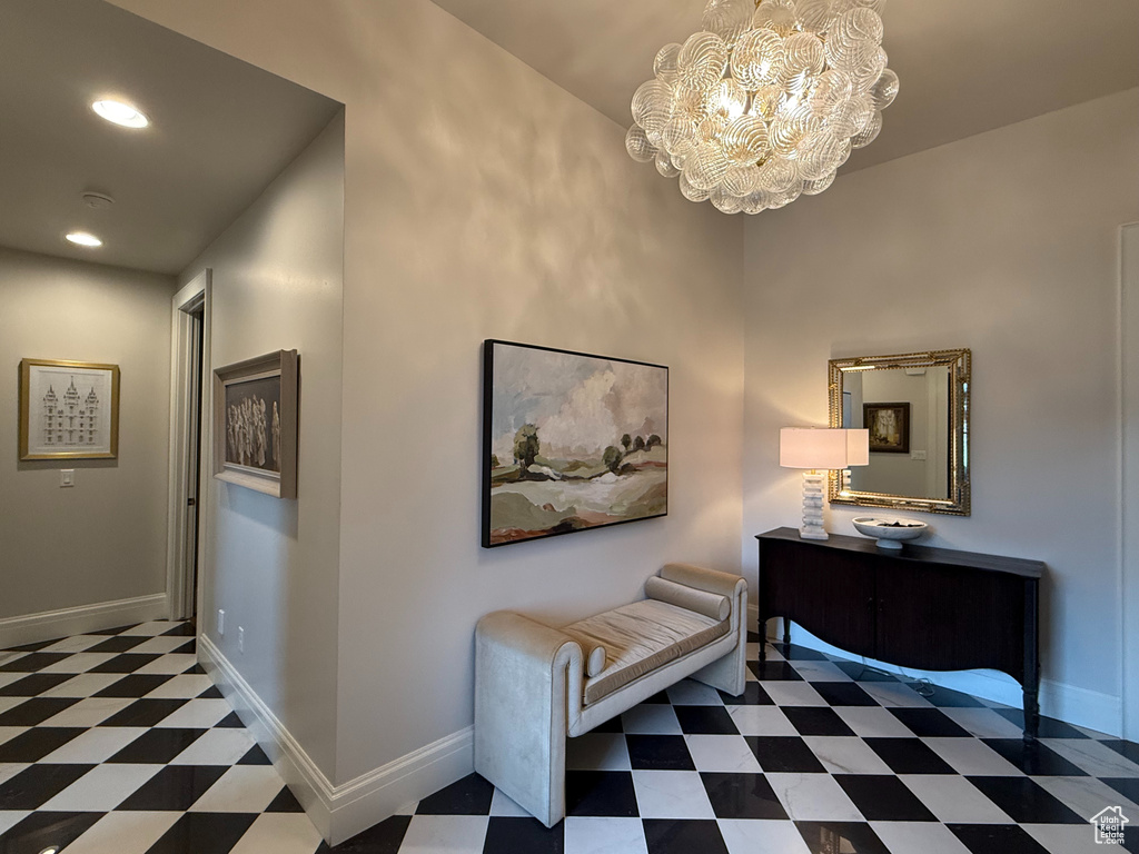 Hallway featuring tile patterned floors, a chandelier, and recessed lighting