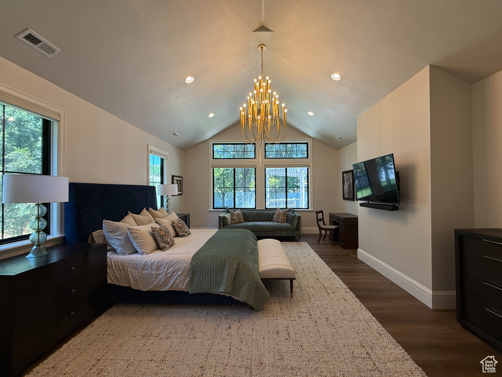 Bedroom with dark wood finished floors, recessed lighting, a chandelier, and vaulted ceiling