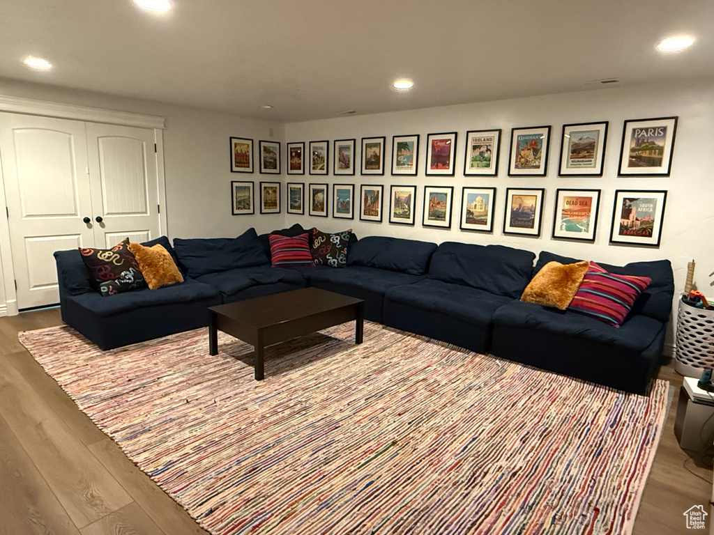 Living room featuring wood finished floors and recessed lighting