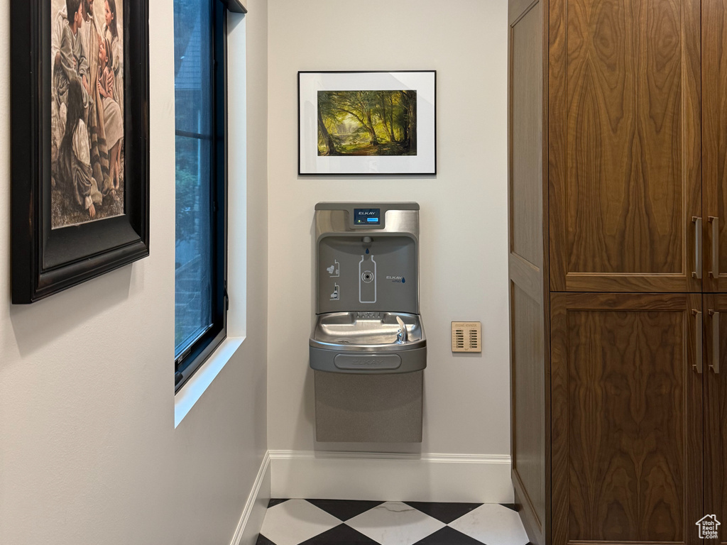 Hall featuring light flooring and recessed lighting