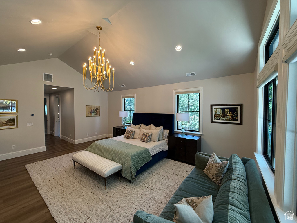 Bedroom featuring wood finished floors, a chandelier, high vaulted ceiling, and recessed lighting