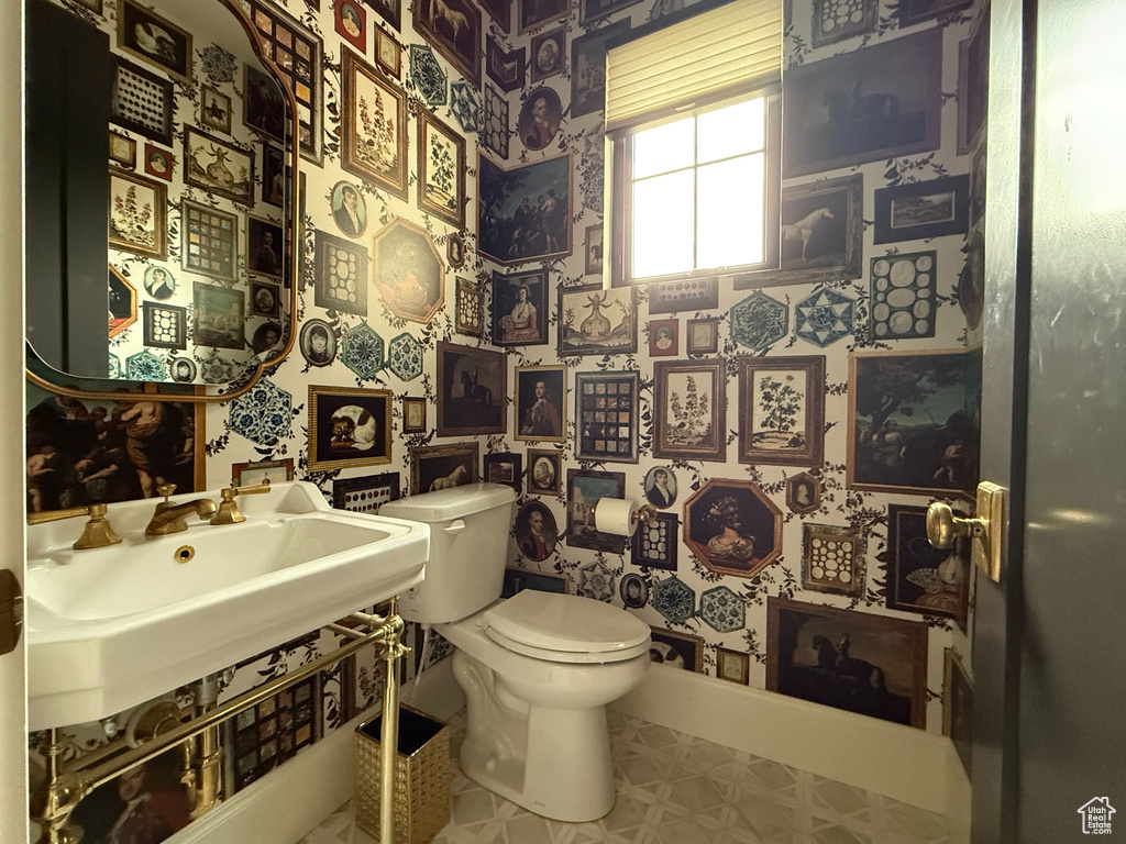 Bathroom with wallpapered walls