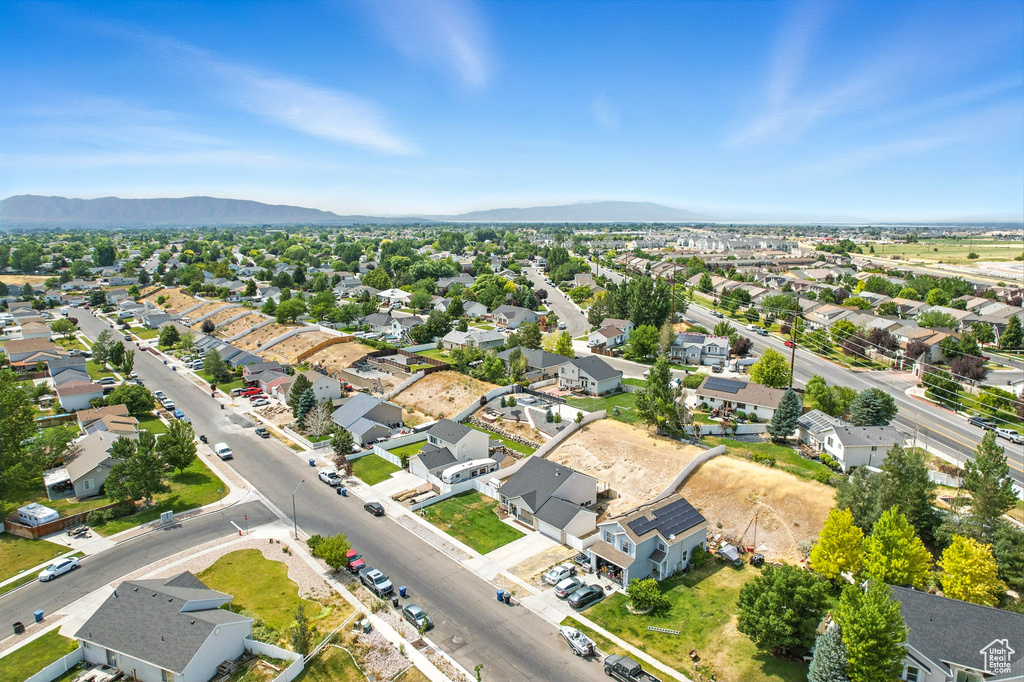 Aerial view of residential area featuring a mountain backdrop