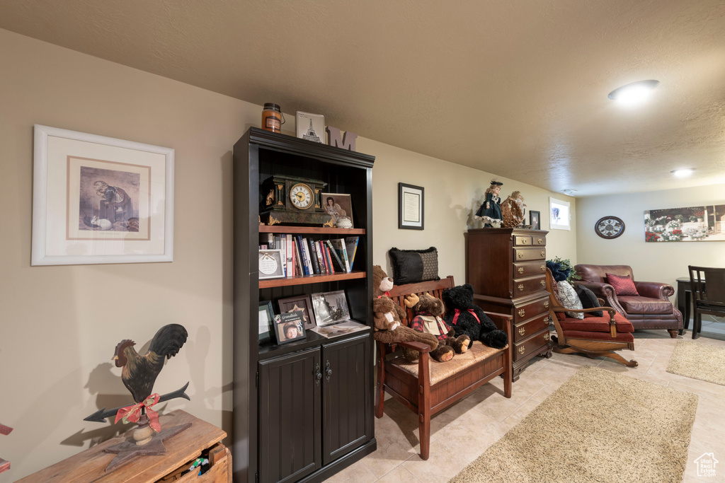 Living area featuring light tile patterned flooring