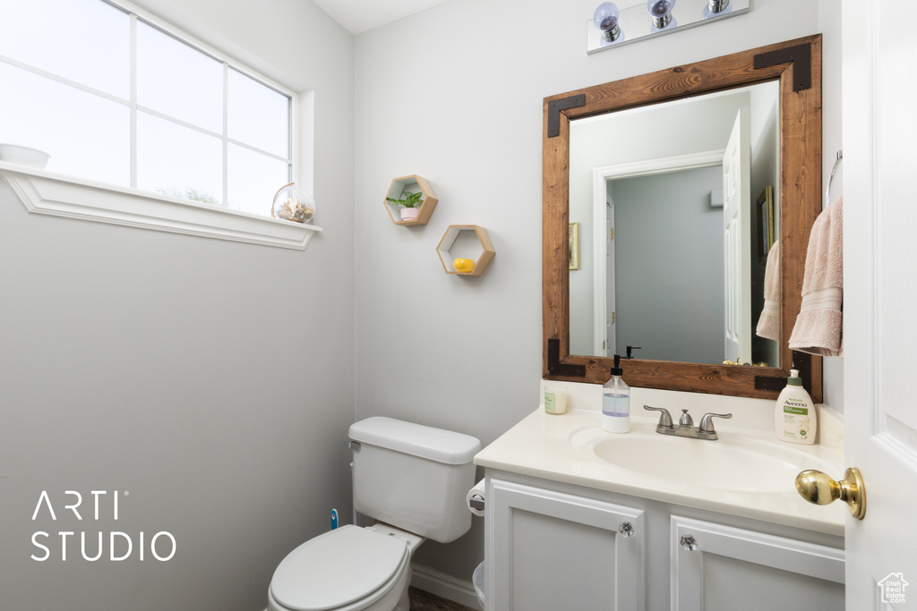 Half bath with toilet and vanity