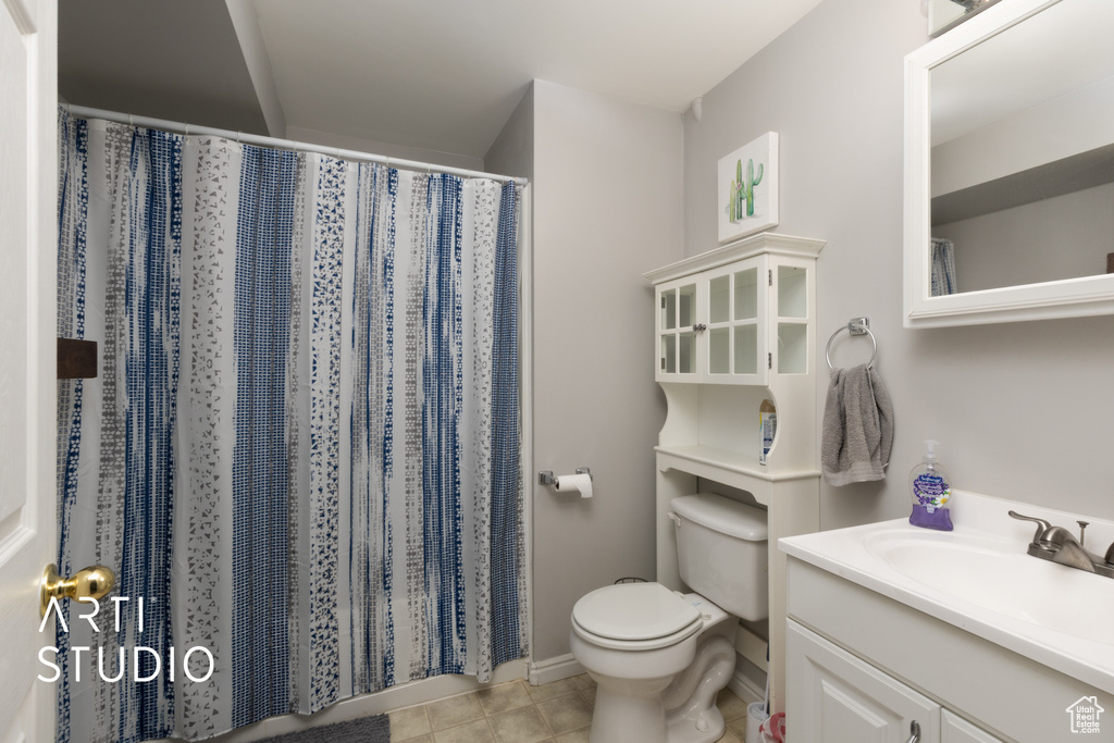 Full bathroom with vanity, tile patterned flooring, and a shower with curtain