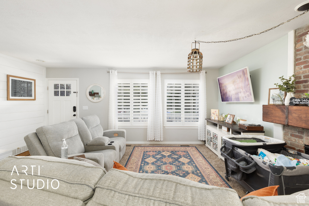 Carpeted living room with baseboards