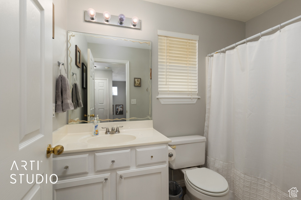 Bathroom with vanity and a shower with shower curtain