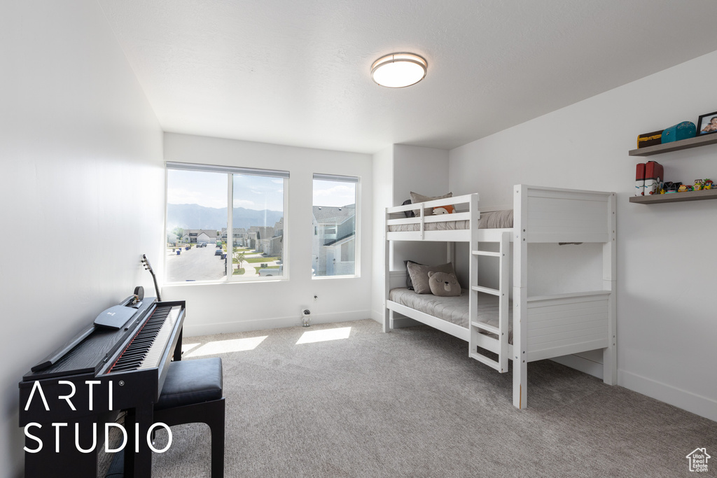 Carpeted bedroom with baseboards