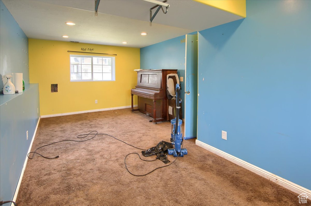 Basement featuring recessed lighting and carpet floors