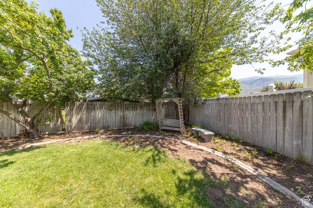 View of fenced backyard