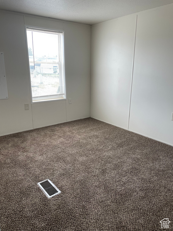 Empty room featuring carpet floors