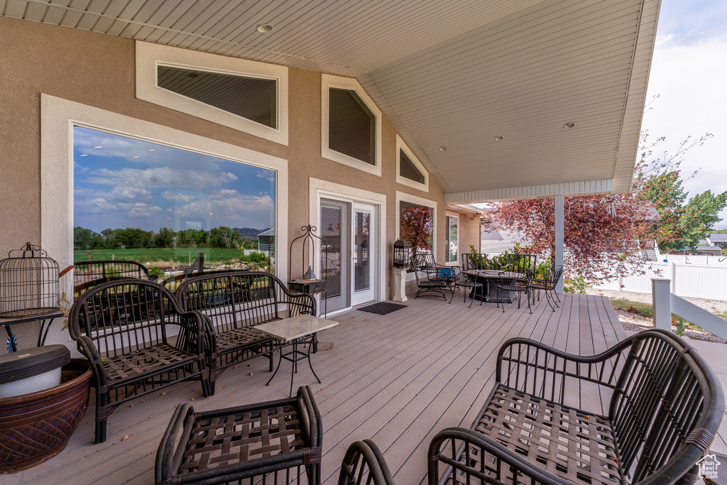Wooden terrace featuring outdoor dining area