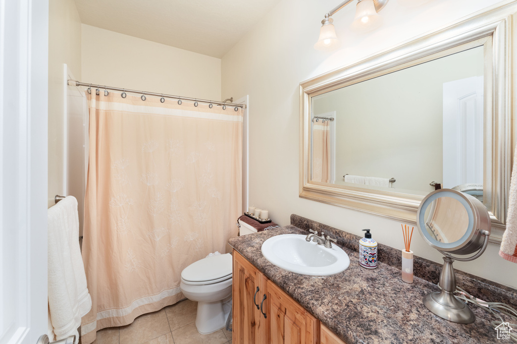 Bathroom with vanity and tile patterned flooring