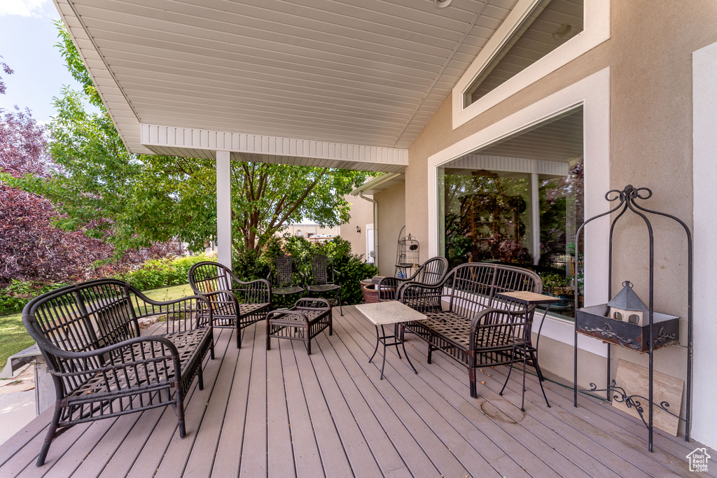 Deck featuring an outdoor living space and grilling area