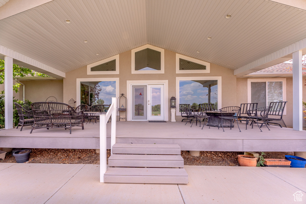 Wooden deck featuring outdoor dining area