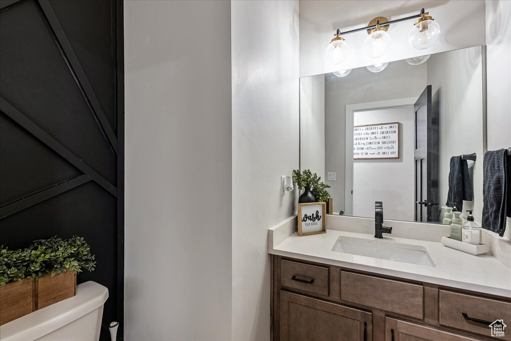 Bathroom with toilet and vanity
